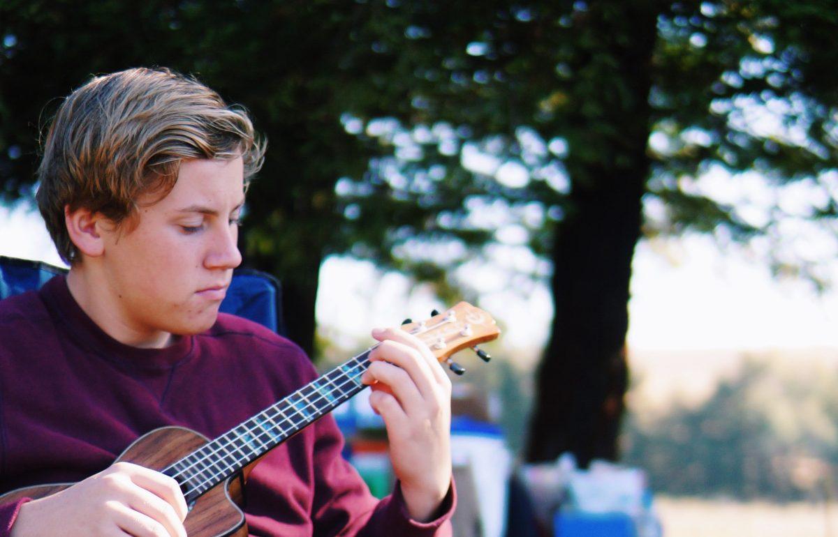 Sophomore Hayden Shaffer brushes up on his ukulele skills. [Tobey Reyes]