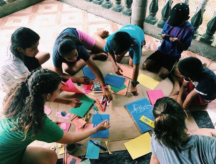 Thornton (bottom left) and fellow volunteers with children at their school in El Ojal, Panama. [Courtesy of Sage Thornton]