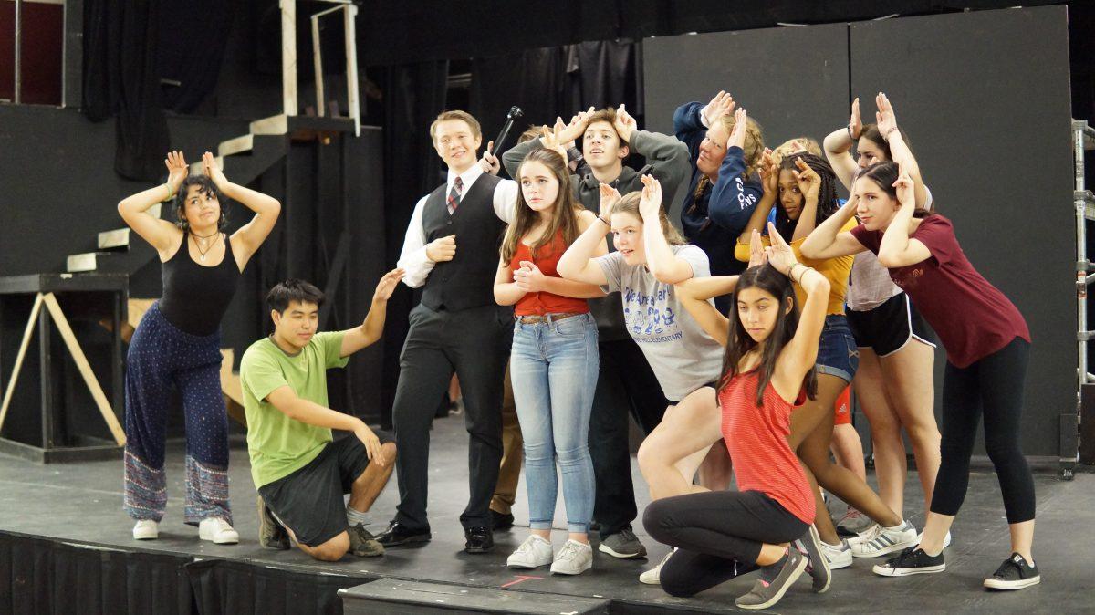 The cast of Urinetown rehearses for their big bathroom break. [Tobey Reyes]