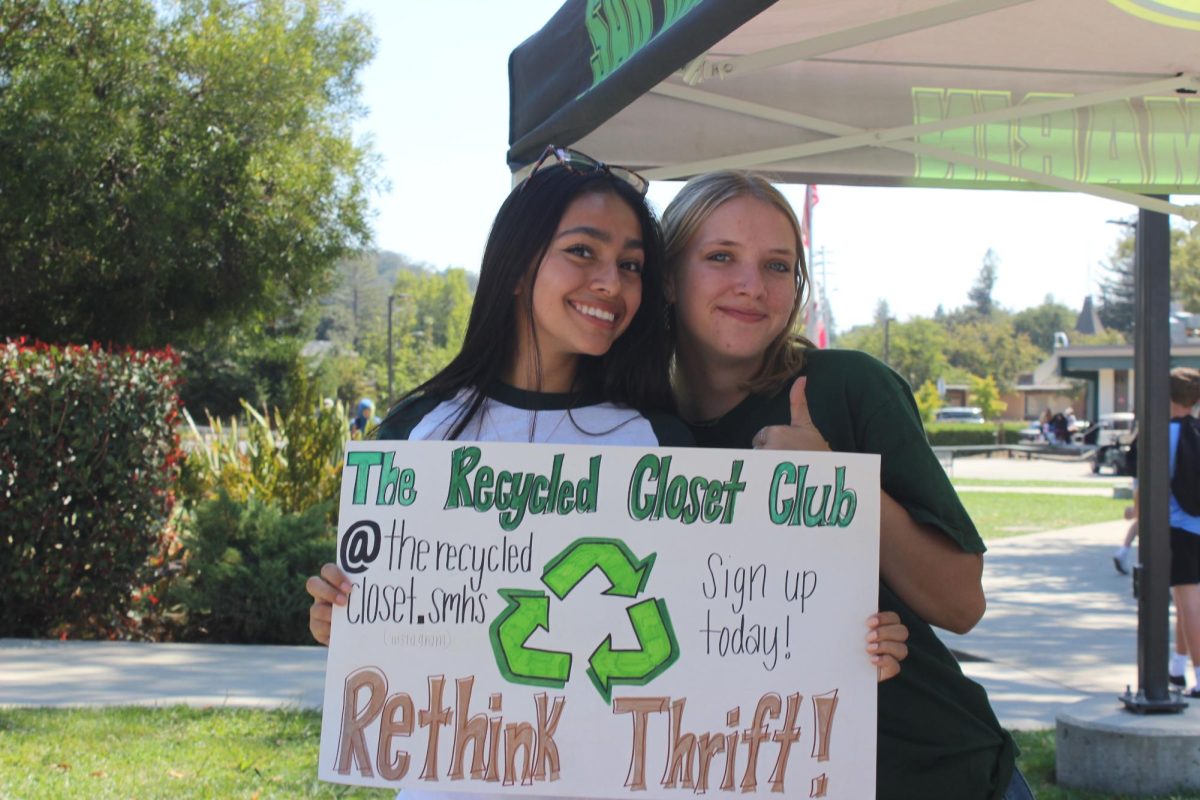 Senior co-presidents Ruth Alvarenga (left) and Reese Nilsen spread their club’s sustainable fashion message at the club fair.