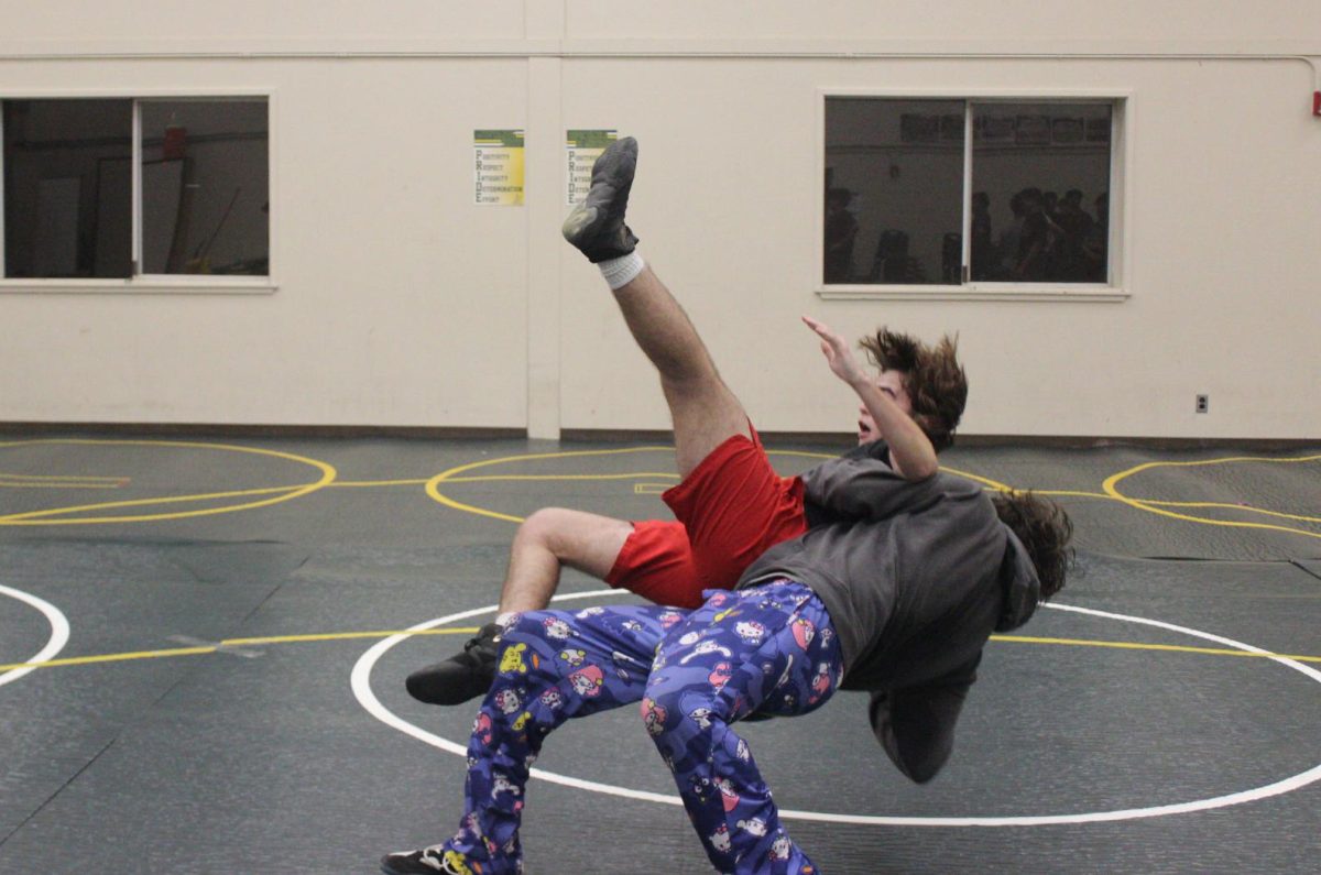 Junior AJ Conkey throws down junior Ben Goffeney for a pin at an open mat practice.