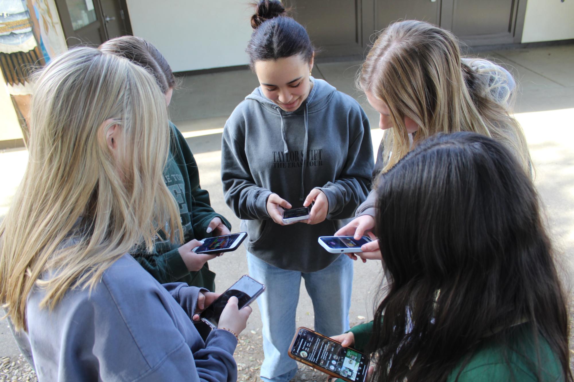 Students spend their break on their phones instead of having conversations.