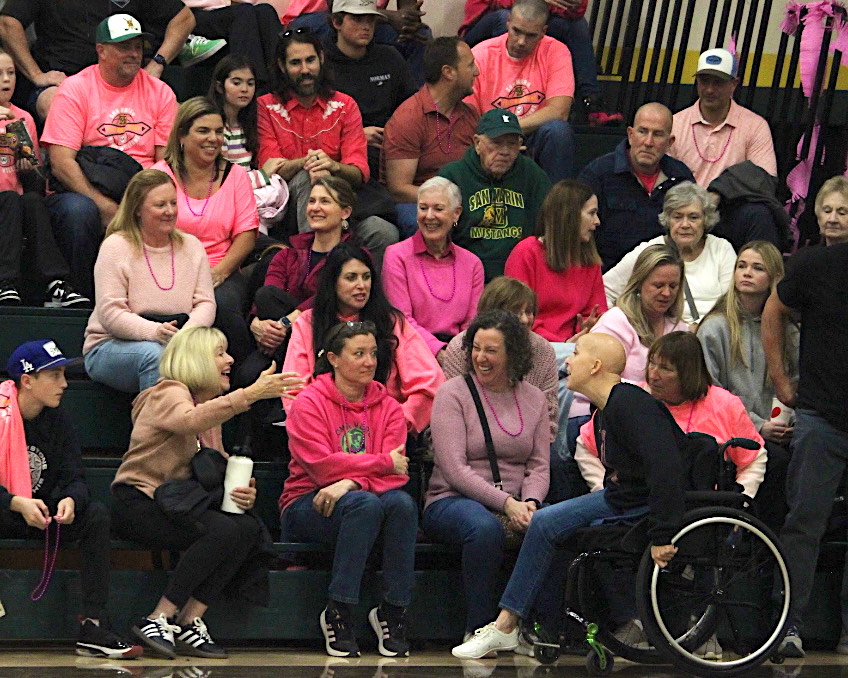 Melissa Boyle recognizes a friend in the crowd.