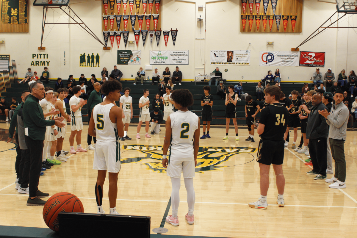 Juniors Miller Morgan (left) and Grant Means address the San Marin and Casa Grande varsity boys basketball teams at a home tournament on Saturday, Jan. 18, 2025. The two players read quotes from John Lewis, one of the civil rights activists that the tournament honors.