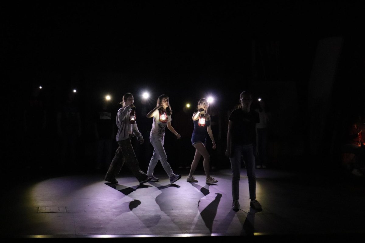 Senior Adi Hirasaki performs "Wait For Me" whilst the Three Fates, (left to right: Mia McGrath, Rosalie Chi, and Ashley Tyson), question the character Orpheus' will.