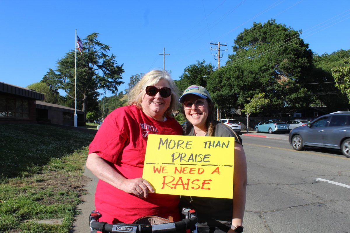 NUSD math teachers Kimberly Laabs and Kaila Budwell peacefully picket outside the May 6 board meeting. Teachers protested the low salary increases compared to inflation in Marin.