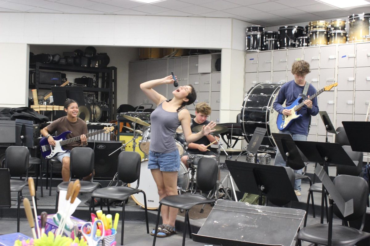San Marin rock band members (From left to right: junior Bella Lindsay, senior Story Ng, sophomore Van Crowther, and senior Rex Smith) practice in the music room 