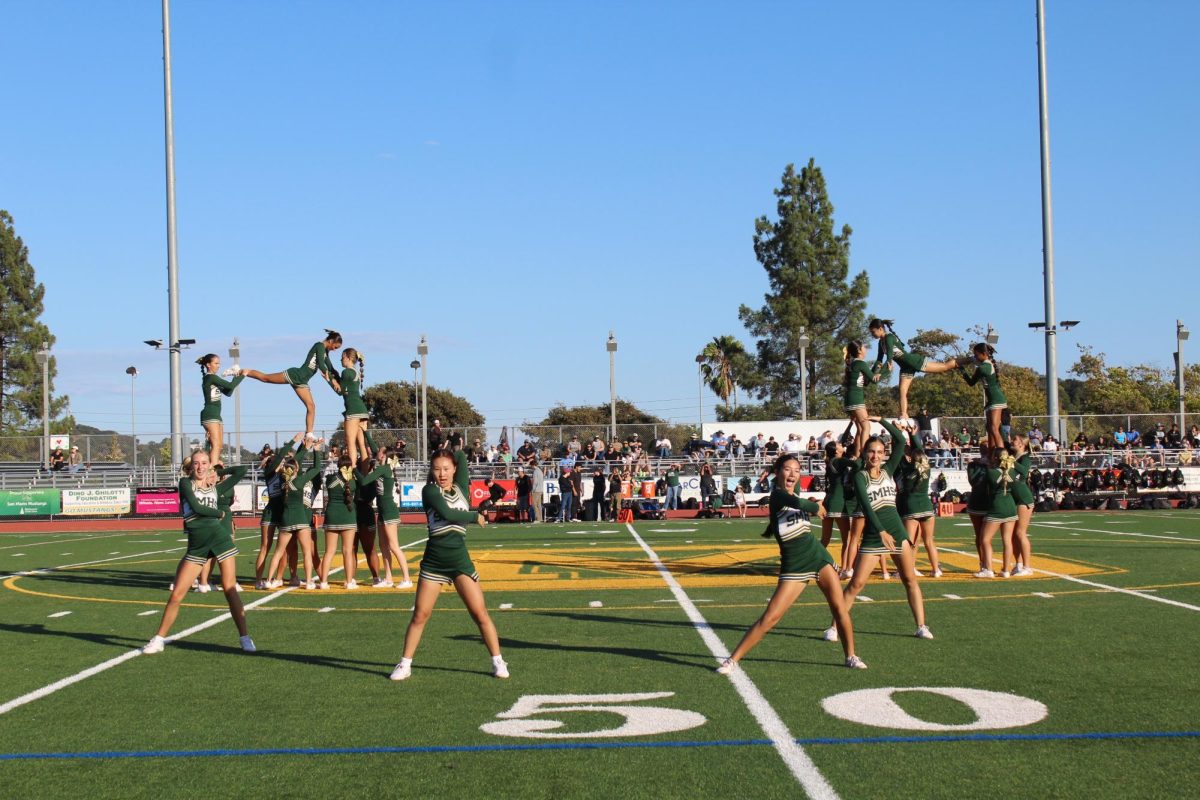 San Marin Junior Varsity cheerleaders dance and stunt during their halftime performance on
Sept. 19 against Casa Grande.