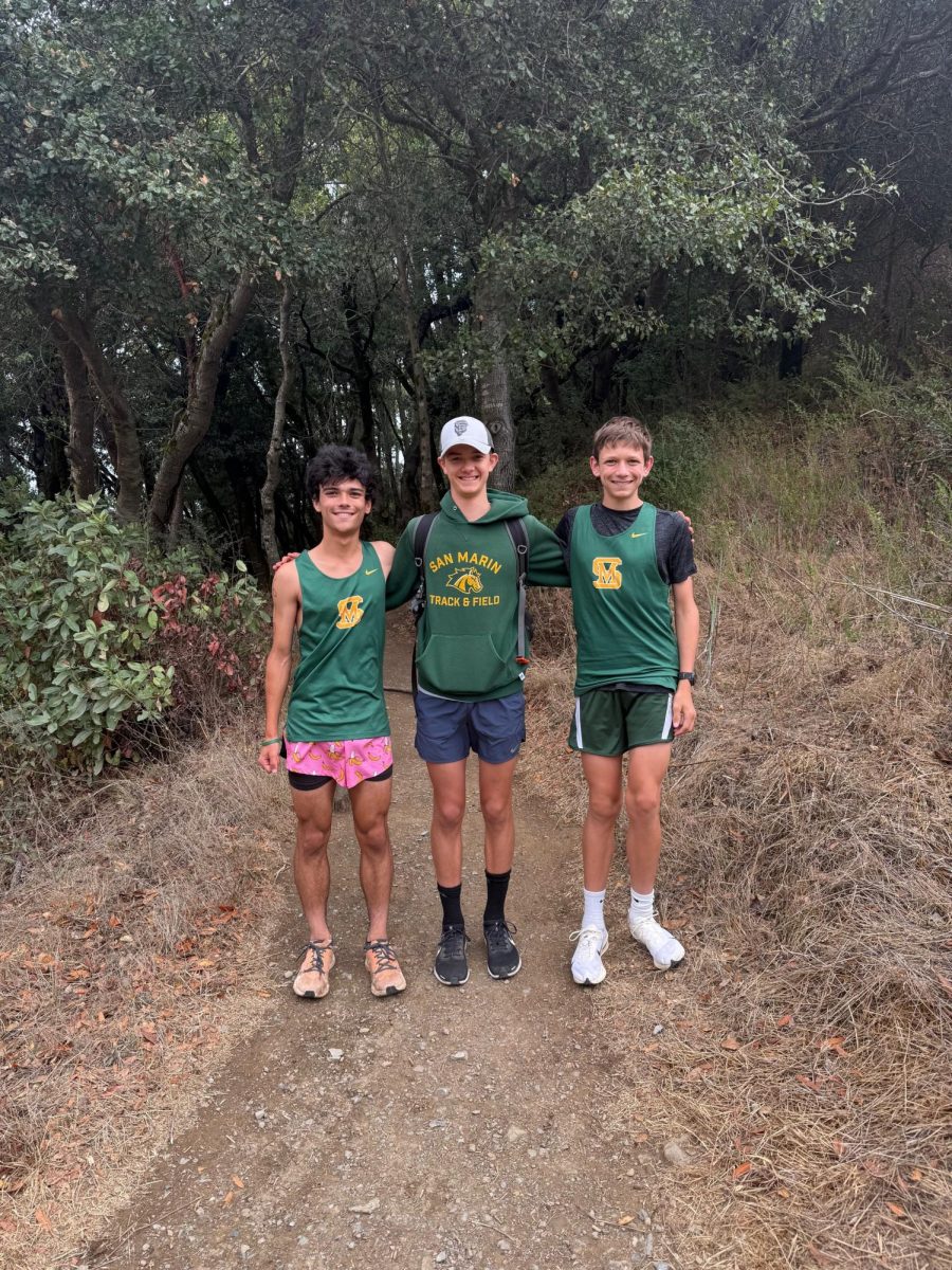 (Left to right) Cross Country runners sophomore Jacob Gomez Nillson, senior Justin Catanach, and sophomore Chase Cloney pose for a photo before their meet on Sept. 30. 