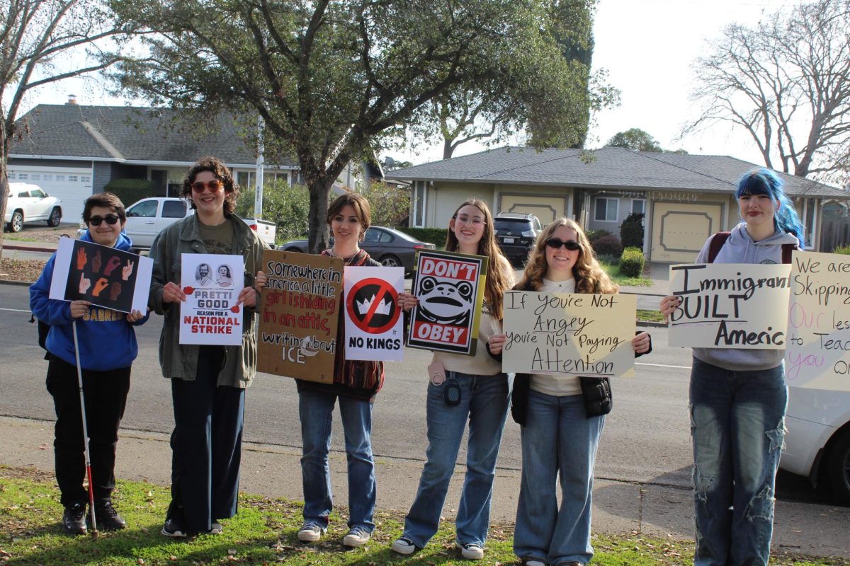 Left to Right: Seniors Walt Novosardian, Julia Martinez, Shay Schifter, Maya Waldorf, Ruby Jae Hudlow, and Annabelle Brownfield protest Immigrations and Customs Enforcement outside of San Marin High School.