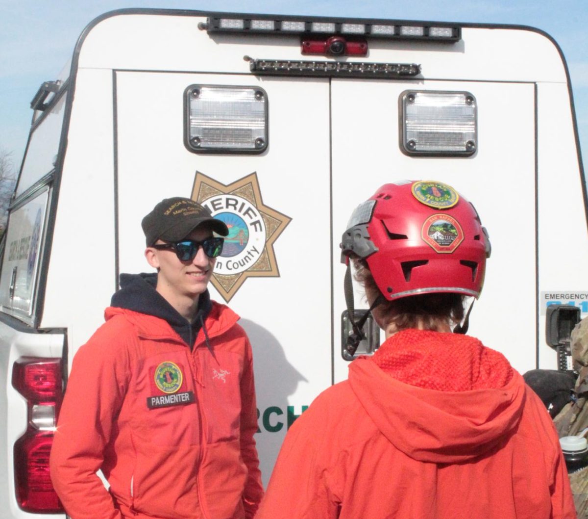Terra Linda High School senior Brooks Parmenter (left) and San Marin High School junior Cody Davis (right) discussing the day's training plan in front of the rescue truck.