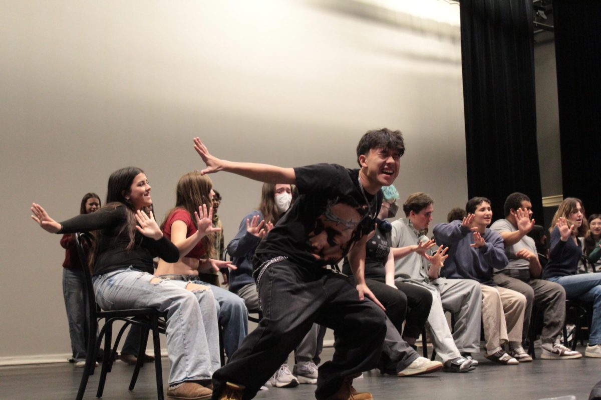 Freshman Skyler Viola performs "La Vie Boheme" in front of the cast of "Rent School Edition" during a rehearsal. 
