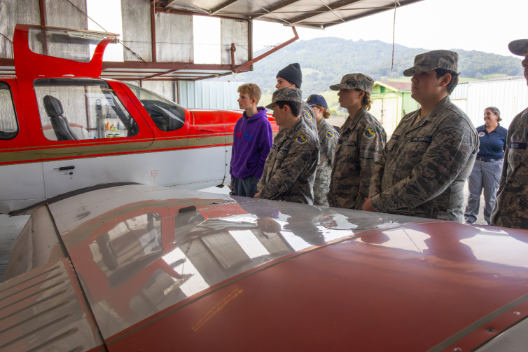 From left to right: Cadet Airmen Riley Stowell, Tanner Stowell, and Sebastian Parris attend a
training flight at Gnoss Field Airport in Novato.