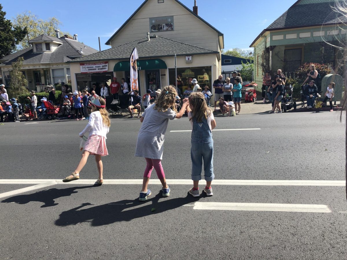 Children watching the festivities and the parade, which is a long-standing tradition of the festival.
