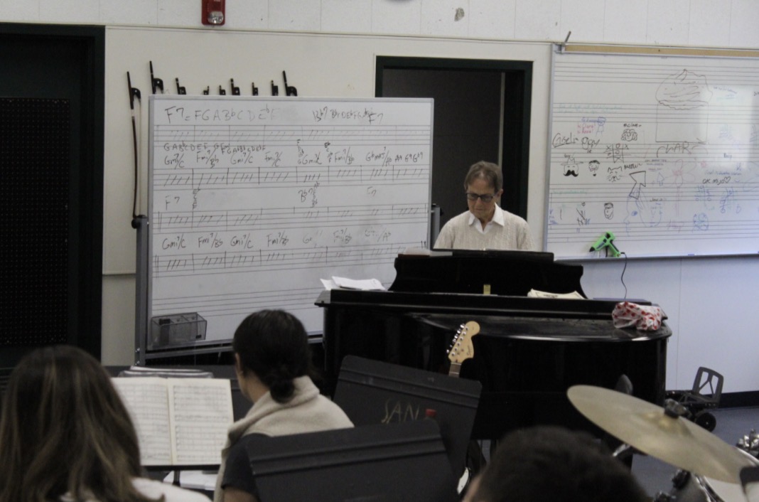 Emily Gates plays the piano while harmonizing with her fourth
period choir class. Gates has taught choir at San Marin High
School since 1980.