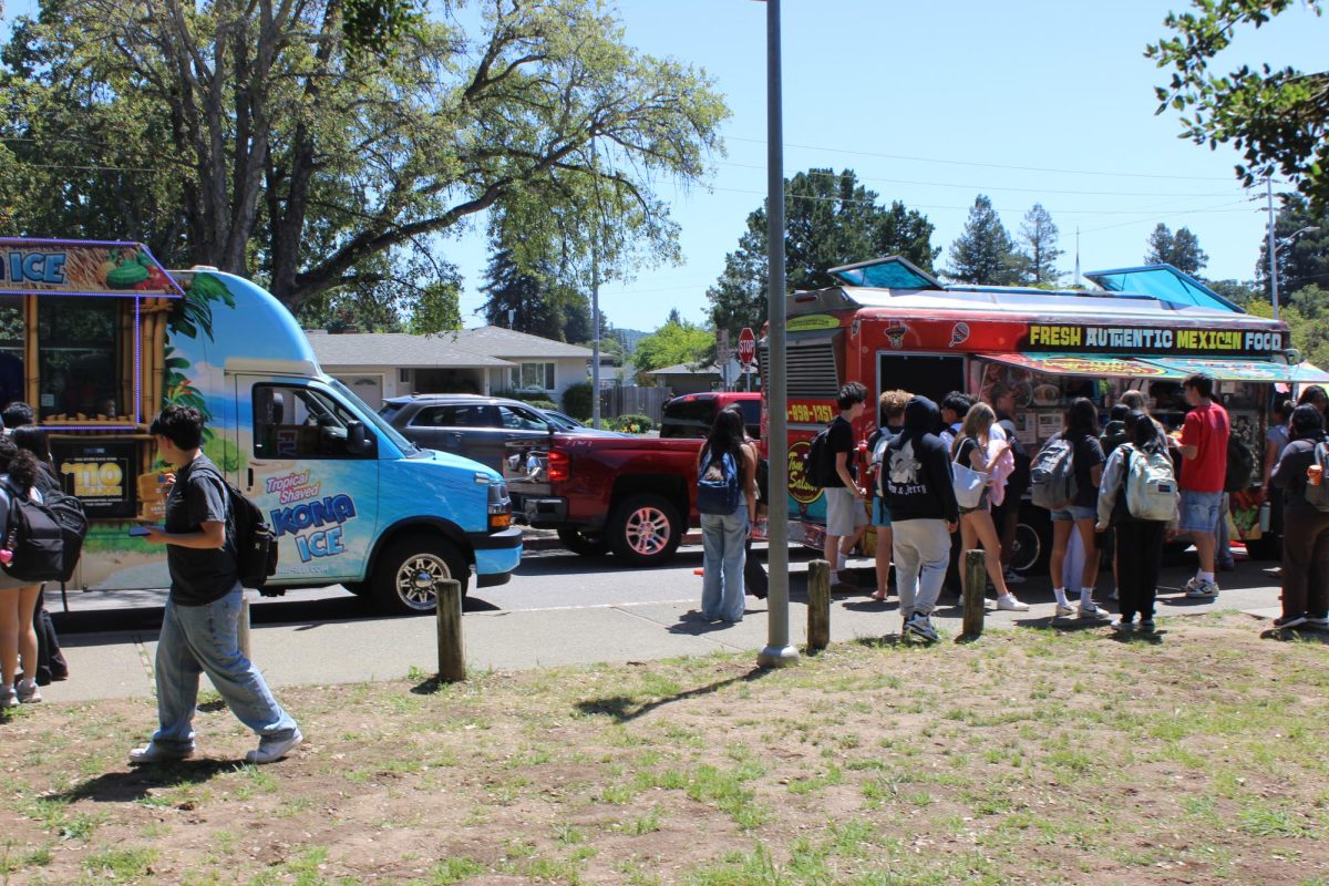 Kona Ice (left) and Tommy's Salsa (right) sell food and sweet treats to students during lunch.