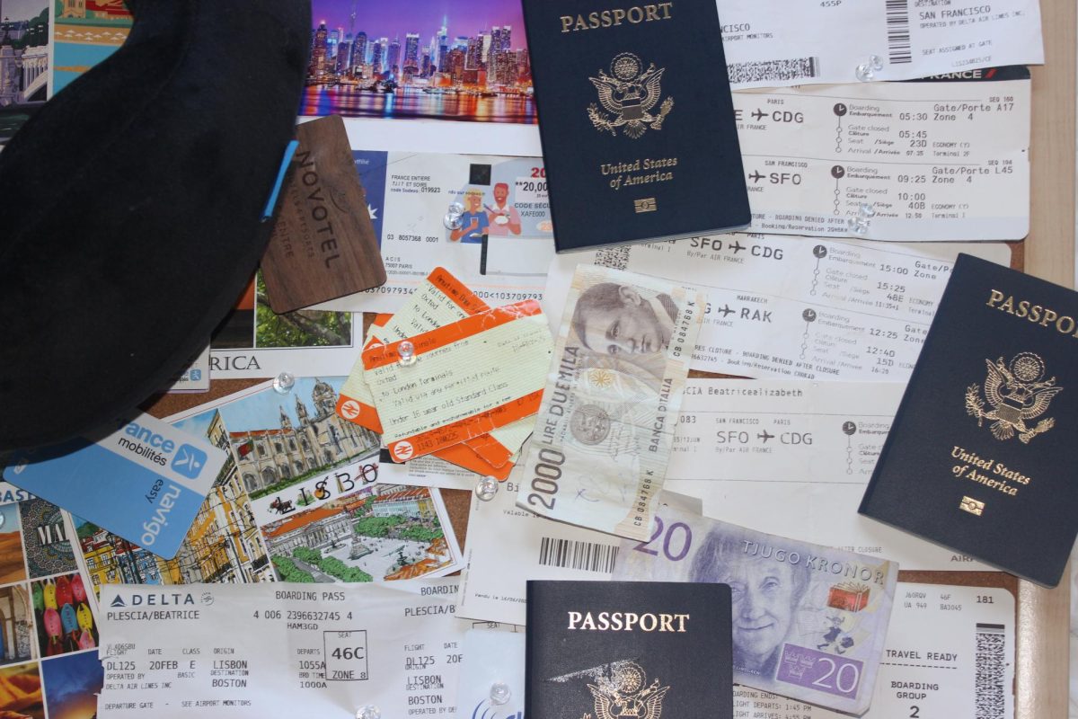 A bulletin board of boarding passes, international currency, hotel key cards, and more. This is a collection of travel memories and objects from a San Marin student.
